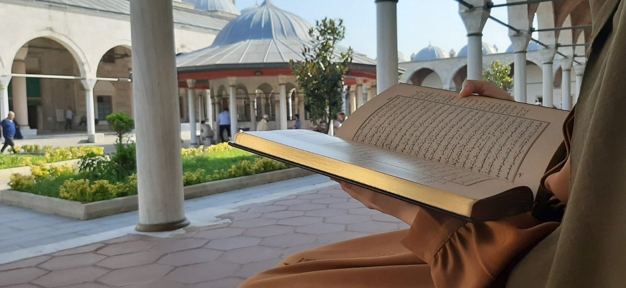 Reading in the mosque courtyard